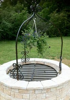 an outdoor fire pit in the middle of a field