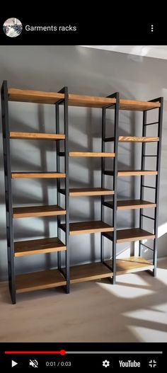 three wooden shelves in the middle of a room