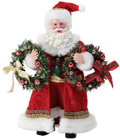 a santa clause figurine with wreaths and bells on it's chest