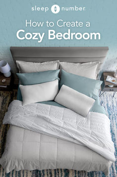 a bed with blue and white pillows on it in front of a wall that says sleep number how to create a cozy bedroom