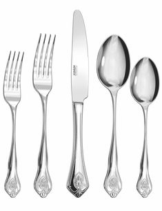 an assortment of silverware including forks, knives and spoons on a white background