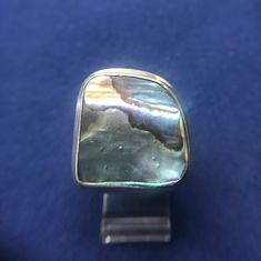 This is a large Abalone Shell set in Sterling Silver.  The dimensions of the ring are just under 1 inch around.  The ring is not round and not square but somewhere in between.  The colors are so vivid. Abalone Ring, Abalone Jewelry, Jan 1, Abalone Shell, The Ring, Rings Statement, Statement Rings, 1 Inch, Jewelry Rings