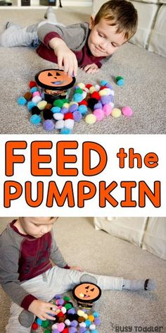 a boy playing with pom poms on the floor and feed the pumpkins