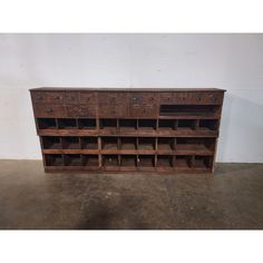 an old wooden desk with many drawers