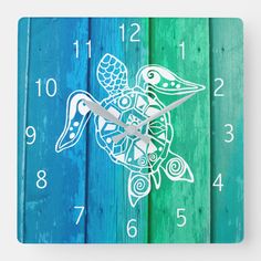 a wooden clock with an image of a sea turtle on it's face and numbers