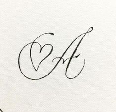 the letter e is inscribed in cursive writing with a heart on it's side