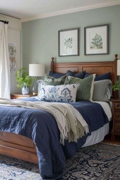 a bedroom with blue and green decor in it