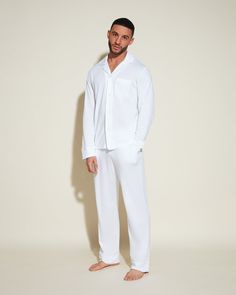 Super soft Long Sleeve Top & Pants set in Pima Cotton and Modal. Flat, satin piping in contrast shades. Straight leg pants with contrast color drawstring. Relaxed fit button down top with chest patch pocket and lapel collar. Cold water wash and hang to dry. White Pyjamas, White Pajamas, Loungewear Luxury, Man Set, Top Pants Set, Mens Pajamas, Lapel Collar, Pima Cotton, Straight Leg Pants