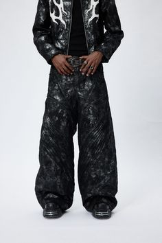 The Faux Leather Wrinkled Motorcycle Pants are a perfect blend of wild style and practical functionality. These baggy motorcycle pants are crafted from faux leather, offering a rugged and edgy look that's faded throughout for a worn-in, vintage appeal. The design features intricate spliced and wrinkled detailing, which not only adds visual depth and texture but also enhances the pants' overall aesthetic. Despite the imitation leather texture, these pants are designed to maintain a degree of brea Black And White Streetwear Men, Winter Streetwear Leather Pants, Winter Streetwear Full-length Leather Pants, Wide Leg Leather Pants For Winter Streetwear, Edgy Wide-leg Parachute Pants For Fall, Edgy Wide Leg Parachute Pants For Fall, Wide Leg Leather Pants For Fall Streetwear, Biker Style Fall Streetwear Pants, Biker Pants For Streetwear In Fall