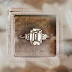 Emerald Cut Moissanite Engagement Ring, Art Deco Wedding Ring, Perfect Anniversary Gift, Women's Jewelry, Pretty Ring Gift For Wife, Side Baguette and Round Ring, Valentine's Gifts, Minimalist Ring ► 𝐎𝐭𝐡𝐞𝐫 𝐬𝐢𝐳𝐞𝐬 𝐚𝐫𝐞 𝐚𝐯𝐚𝐢𝐥𝐚𝐛𝐥𝐞: ● Emerald Stone Sizes: ➜ 1.2 Ct (7x5 mm) ➜ 1.8 Ct (8x6 mm) ➜ 2.5 Ct (9x7 mm) ➜ 3.5 Ct (10x8 mm) ● 𝐂𝐞𝐧𝐭𝐞𝐫 𝐒𝐭𝐨𝐧𝐞 𝐃𝐞𝐭𝐚𝐢𝐥𝐬: → Stone Type: Moissanite → Shape: Emerald Cut → Size: 2.5 CT  → Measurement: 9x7 MM  → Color: Colorless → Luster: Excellent → Make: High Quality  ● 𝐒𝐢d𝐞 𝐒𝐭𝐨𝐧𝐞 𝐃𝐞𝐭𝐚𝐢𝐥𝐬: → Stone Type: Moissanite → Shape: Baguette & Round Cut → Size: 0.2 TCW (Approx) → Measurement: 3x1.5 mm, 1 mm → Color: Colorless → Luster: Excellent → Make: High Quality  ● 𝐌𝐞𝐭𝐚𝐥 𝐎𝐩𝐭𝐢𝐨𝐧: ⇨ 925 Sterling Silver ⇨ 10KT/14K Moissanite Engagement Ring Emerald, Engagement Ring Emerald Cut, Emerald Cut Moissanite Engagement Ring, Dream Rings, Engagement Ring Emerald, The Bling Ring, Ring Emerald Cut, Cute Engagement Rings, Future Engagement Rings