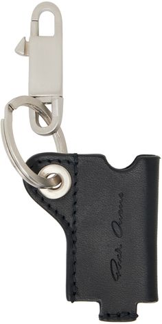 a black leather keychain with a metal clip