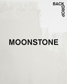 the back side of a white wall with black lettering on it that reads, moon stone