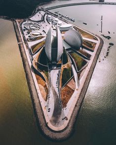 an aerial view of a building in the water