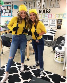 two girls dressed in yellow posing for the camera