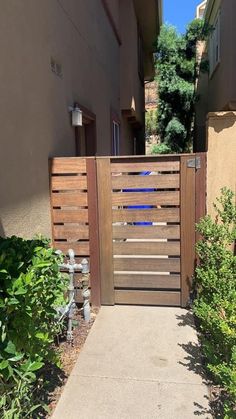 an entrance to a house with a wooden gate