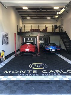 two cars are parked in front of the monte carlo garage entrance with stairs leading up to them