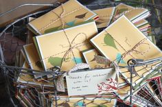 a basket filled with lots of cards and envelopes on top of eachother