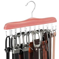 a wooden hanger with several different types of belts hanging from it's hooks