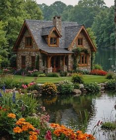 a house is surrounded by flowers and trees in the background, along with a pond