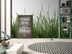 a living room with grass and a poster on the wall