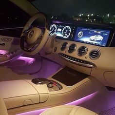 the interior of a car with illuminated dashboard