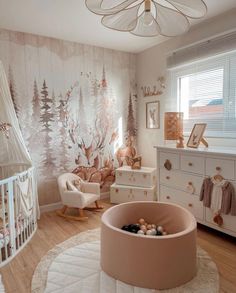 a baby's room decorated in pink and white