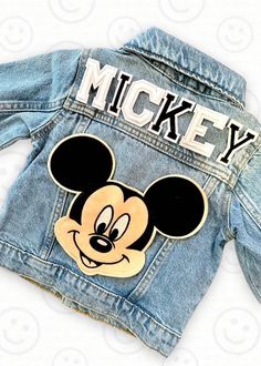 This custom denim jacket is the perfect gift for the D!sney fan in your life!  Makes an amazing birthday gift or jacket to wear on those cool days and nights at the park! Name or monogram  is always included.  This jacket comes with one large Mouse patch (Mickey or Minnie.) and varsity letter patches. Patches are first applied with heat and then machine sewn on for longevity.  However, jacket should always be washed on cool & hung up to dry for longest wear. We have so many patches to choose from (not just the samples shown in photos).  Please reach out if you would like to add additional patches or are looking for something specific.  NOTE: Patches are subject to availability & stock.  If you have a special request we will try our best to make it happen!  Special request patches or extra Fall Mickey Mouse Cotton Outerwear, Disney Denim Jacket, Patch Jean Jacket, Custom Jean, Jean Jacket Patches, Custom Jean Jacket, Custom Denim Jacket, Letter Patches, Patch Jacket