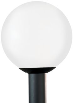 a white light sitting on top of a black pole