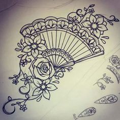 a drawing of a fan with flowers on it