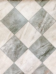 a tile floor with grey and white squares