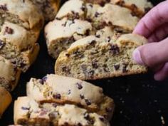 a person picking up some cookies from a tray