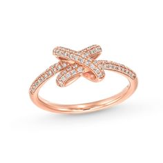 a rose gold ring with white diamonds on the band and an x in the middle