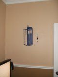 a room with a phone booth on the wall