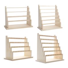 four wooden shelves with steps on each side and one in the middle, all made out of plywood