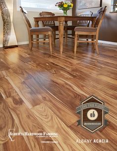 a dining room table and chairs with hardwood flooring in the middle, along with a logo for alderwood floors