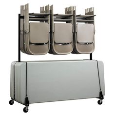 three folding chairs on wheels and one with four seats attached to the back of it