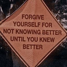 a sign that is on the side of a tree saying, forgve yourself for not known better until you knew better