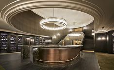 an elegant lobby with marble counter tops and chandelier