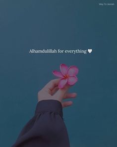 a person holding a pink flower in their hand with the words, i ammutulah for everything