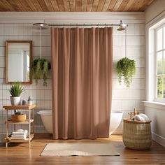 a bath room with a toilet and a shower curtain