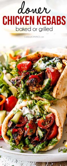 two chicken kebabs on a plate with salad