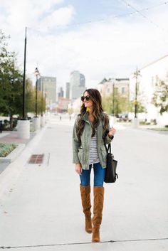 Military green jacket, black striped t-shirt, skinny jeans, over-the-knee suede boots, black handbag, long gold pendant necklace Love this look! Tan Over The Knee Boot Outfit, Brown Over The Knee Boot Outfit, Long Brown Boots Outfits, Tan Boots Outfit, Suede Skirt Outfit, Suede Boots Outfit, Brown Tall Boots, Suede Jacket Outfit, Suede Boots Black