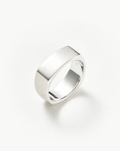 Mens Engravable Matte Wide Ring | Sterling Silver. Handcrafted for Him. The Chunky Band Ring in Classic Sterling Silver is Upgraded with a Brushed Finish and Curved Edges, Plus It Can be Engraved on Top. Pair with a Chunky Chain Bracelet to Create a Statement Look. Please Note: Engraving Items May Take 7-10 Working Days to Process. Metal: Rhodium Plated on Recycled Sterling Silver Band Height: 8mm Weight: 10. 9g Product Code: Mj-S-R3-Ns Wide Silver Ring, Gold And Silver Rings, Star Earrings Stud, Wide Rings, Engraved Items, Pearl Stud Earrings, Ring Size Guide, Men's Rings, Recycled Sterling Silver