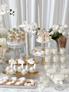 a table topped with lots of desserts and candles