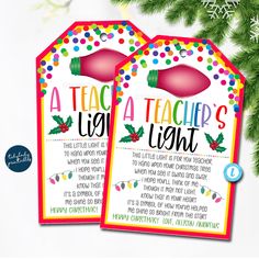 two teacher's christmas gift tags with lights on them