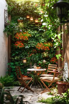 an outdoor dining area with plants and flowers on the wall