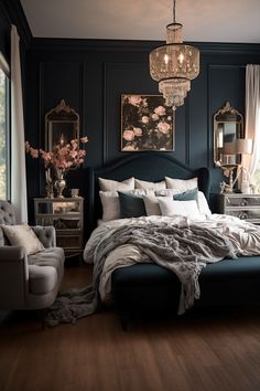 a bedroom with dark blue walls, white bedding and chandelier hanging from the ceiling