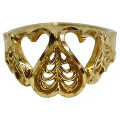 Discover the perfect blend of timeless elegance and playful charm with our 18K Gold Plated 1970s Hearts Ring. Crafted with precision and plated in luxurious 18k yellow gold, this ring showcases a whimsical heart design that will capture your heart. With its feminine and flirty aesthetics, this ring adds a touch of romance to any outfit. The heart-shaped motif symbolizes love and passion, making it an ideal gift to celebrate a special bond or simply to treat yourself to a piece of fine jewelry th Formal Yellow Gold Heart Ring Oval Shape, Heart-shaped Yellow Gold Rings For Formal Occasions, Yellow Gold Rings For Valentine's Day Formal Occasion, Formal Yellow Gold Heart Ring For Valentine's Day, Formal Yellow Gold Rings For Valentine's Day, Vintage Style Gold Plated Yellow Gold Ring, Gold Hallmarked Heart Ring, Vintage Style Gold-plated Yellow Gold Ring, Vintage Style Yellow Gold Plated Rings