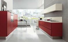 a modern kitchen with red cabinets and white counter tops