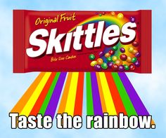 a candy bar with the words skittles taste the rainbow in front of it